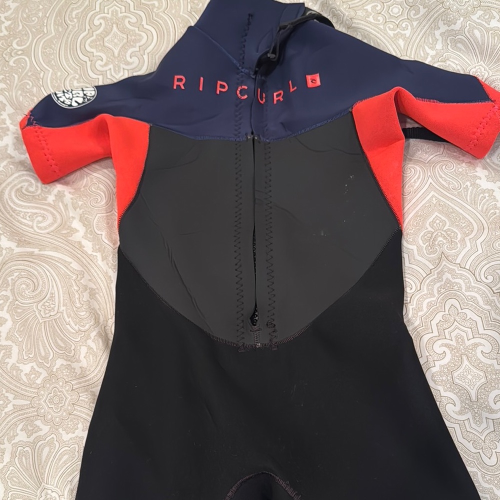 Ripcurl brand kids back zip wetsuit.